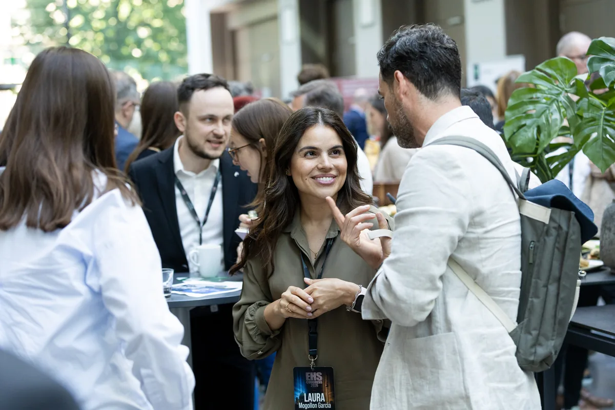 Delegates in conversation during a networking break at EHS Congress